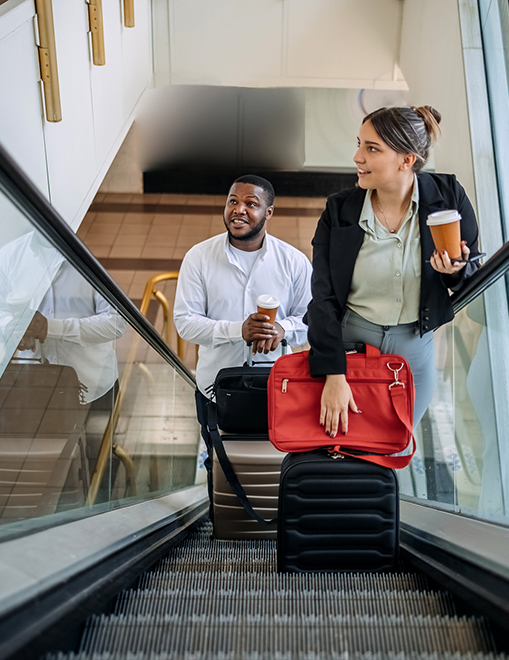 colleagues going up escalator