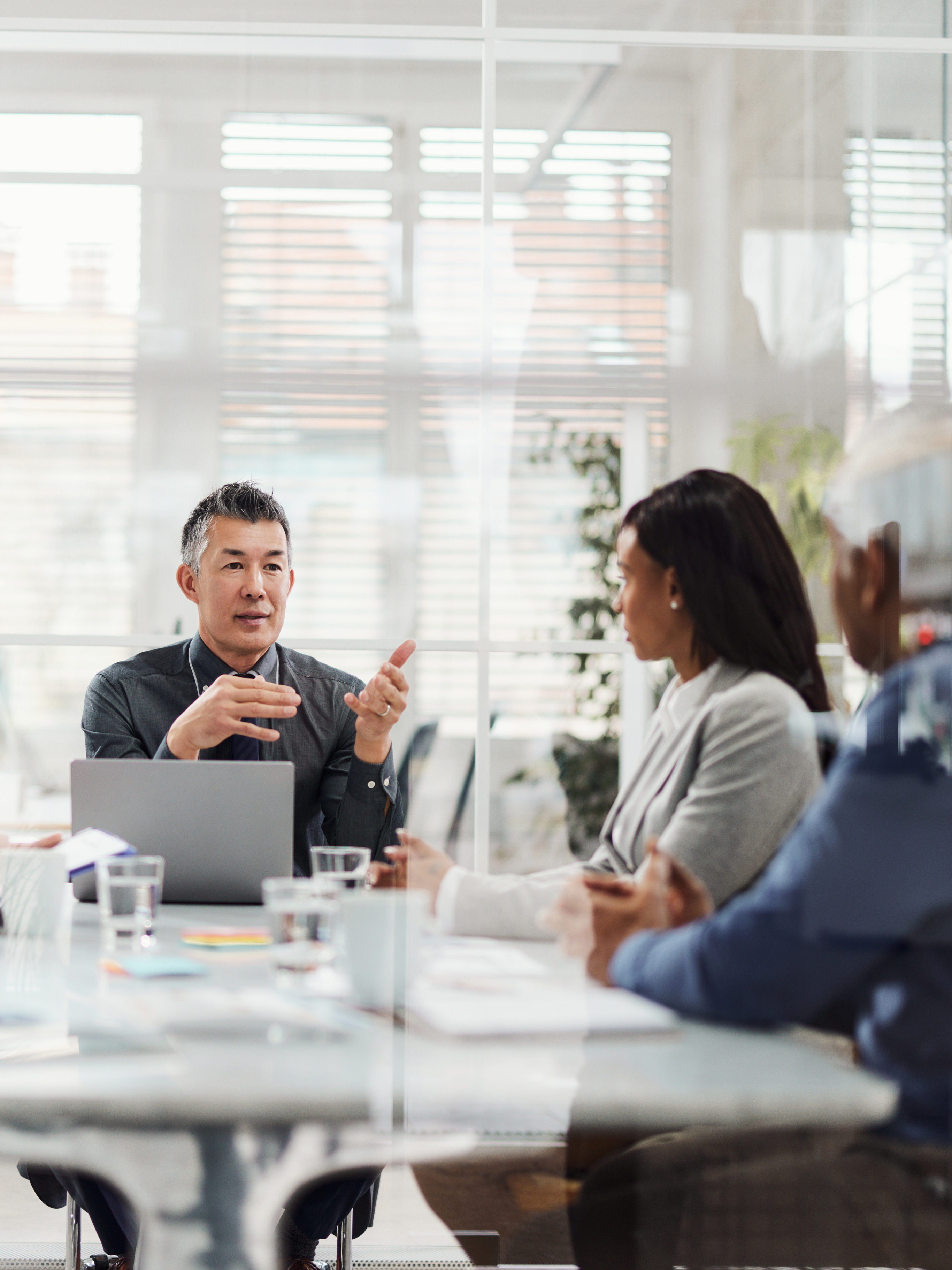 Importance of Strategic Leadership group meeting around a table