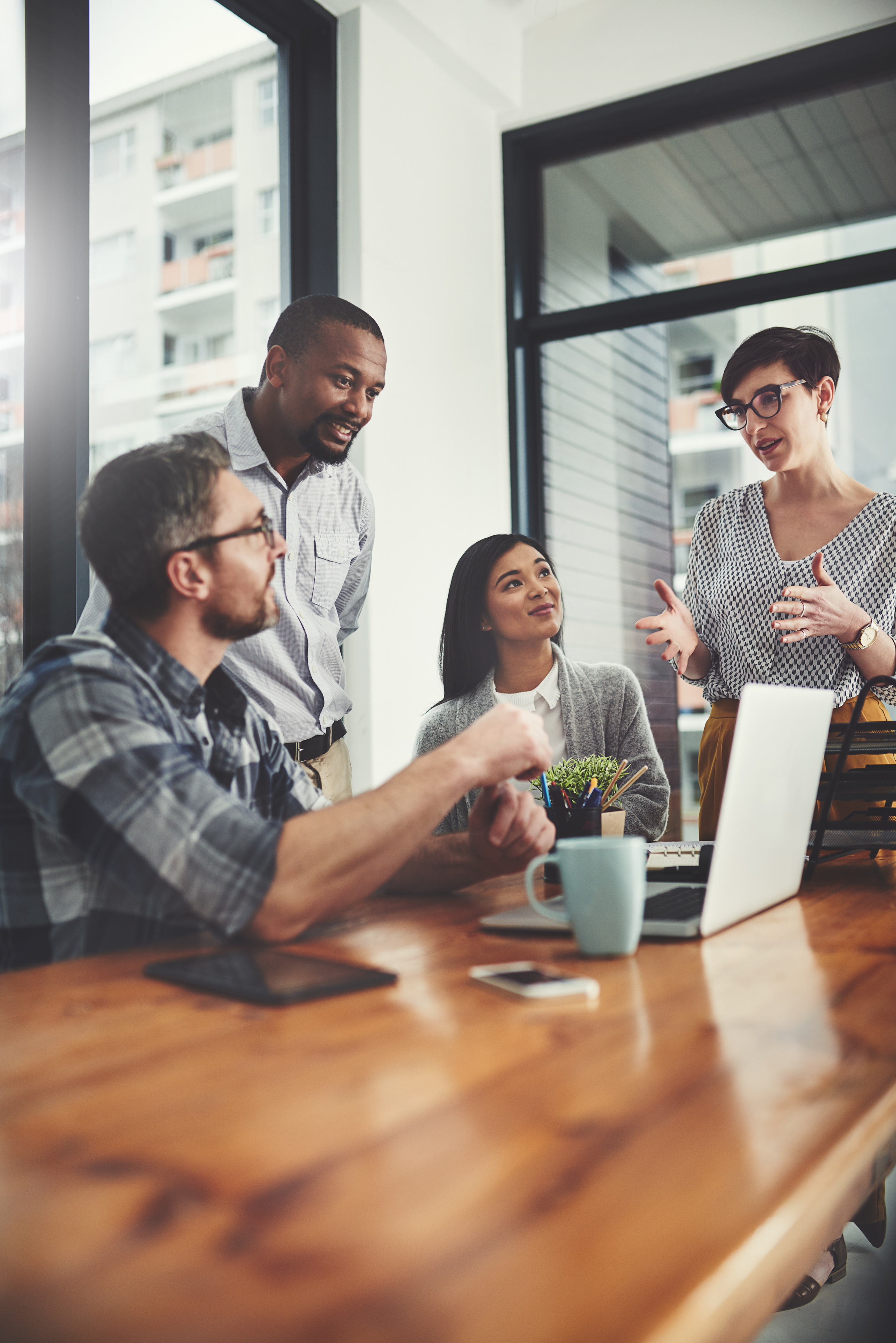Group of people collaborating around a table